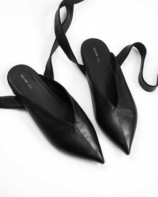 Black Celine pointed-toe shoes with ribbon top view