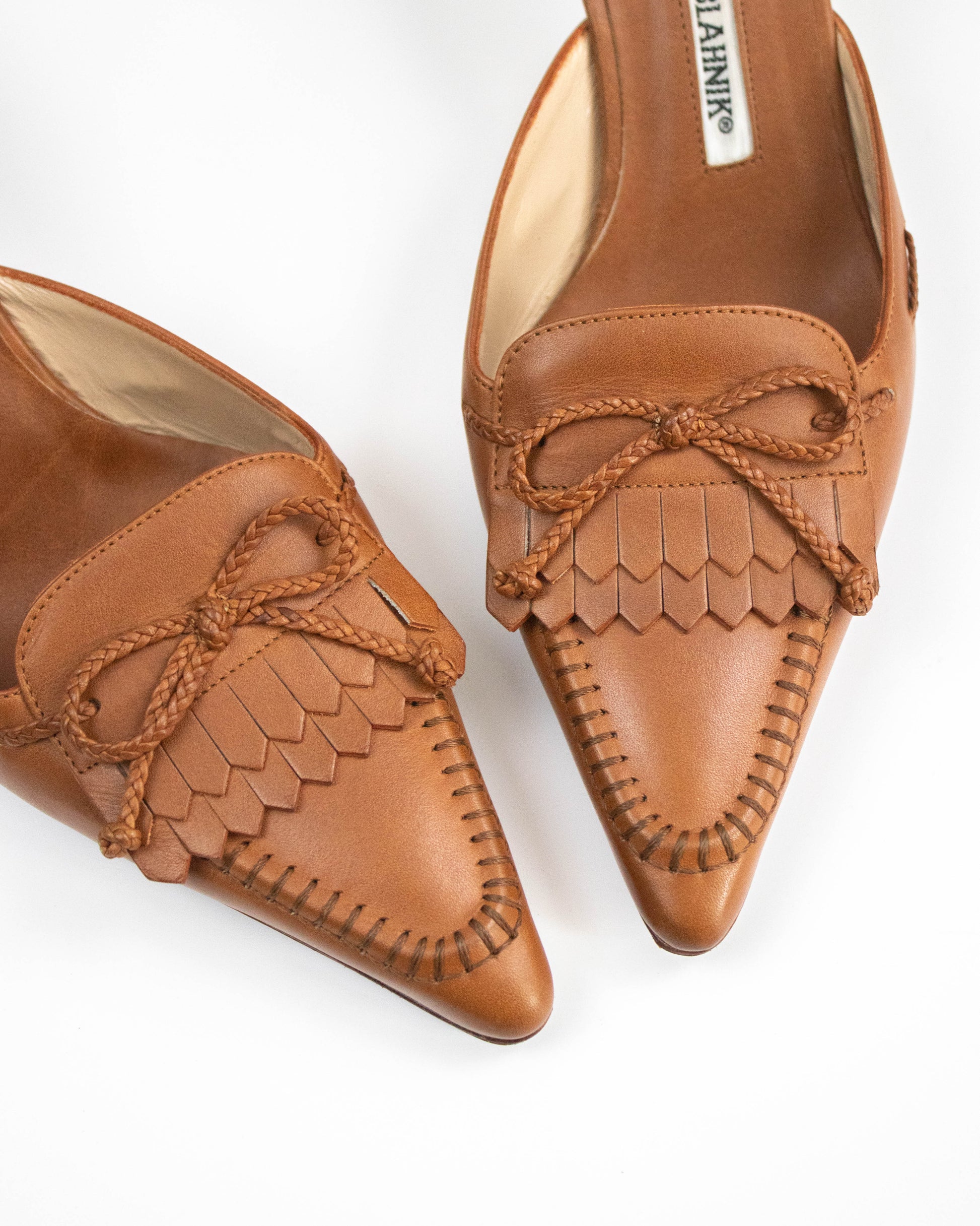 Manolo Blahnik fringed mules with bow detail front view