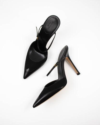Black high-heeled shoes on a white background