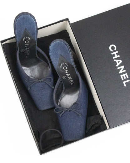Pair of blue Chanel mules in a box top view