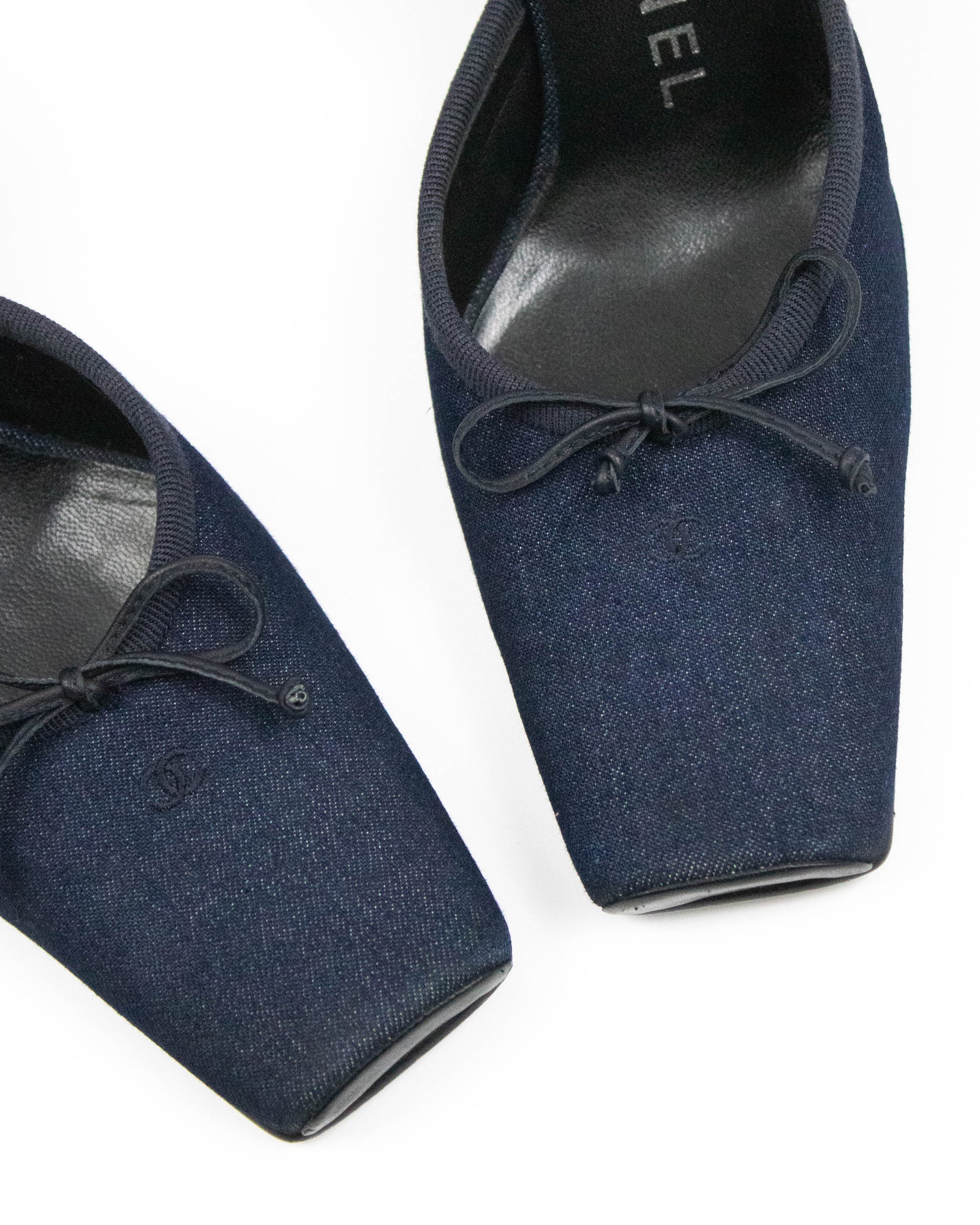 Pair of blue Chanel mules toes close-up view