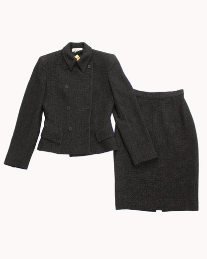 Gray suit jacket and skirt set on a light gray background