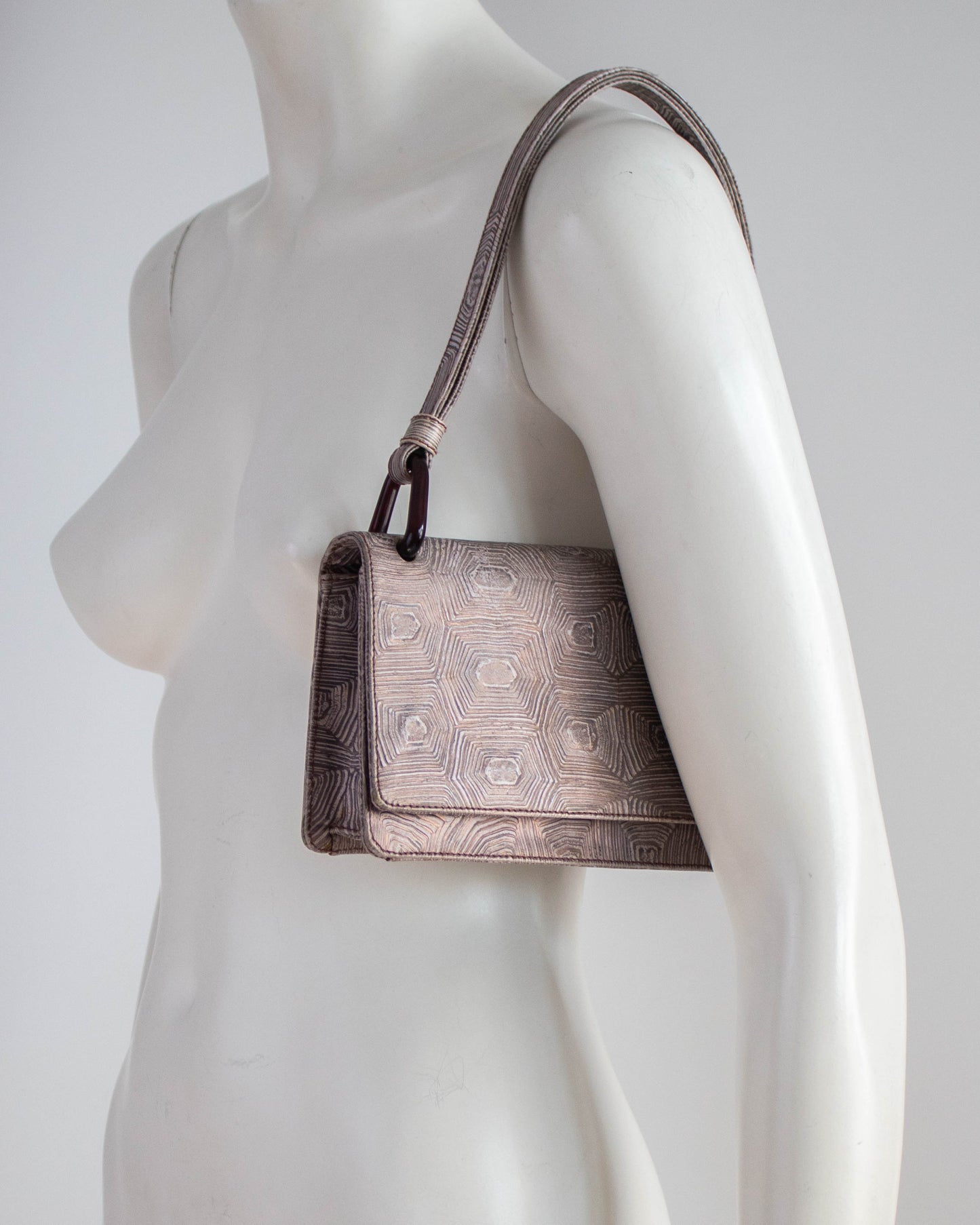 Prada 1996 Tartaruga Bag on a mannequin view