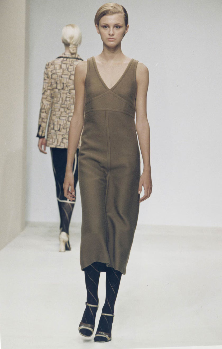 Model wearing a Vintage F/W 1996 Prada Wool Midi Dress on the runway