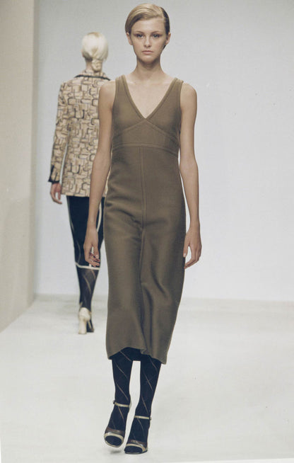 Model wearing a Vintage F/W 1996 Prada Wool Midi Dress on the runway