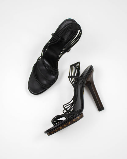 Black high-heeled shoes on a white background