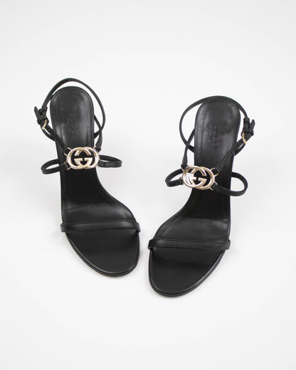 Black Gucci heels with interlocking metal logo front view