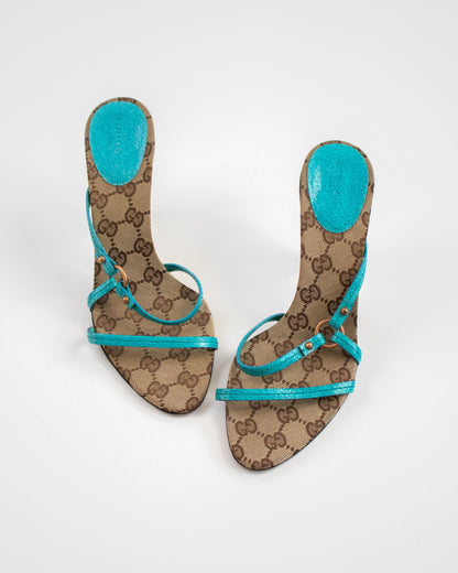 Pair of Gucci sandals with turquoise straps top view