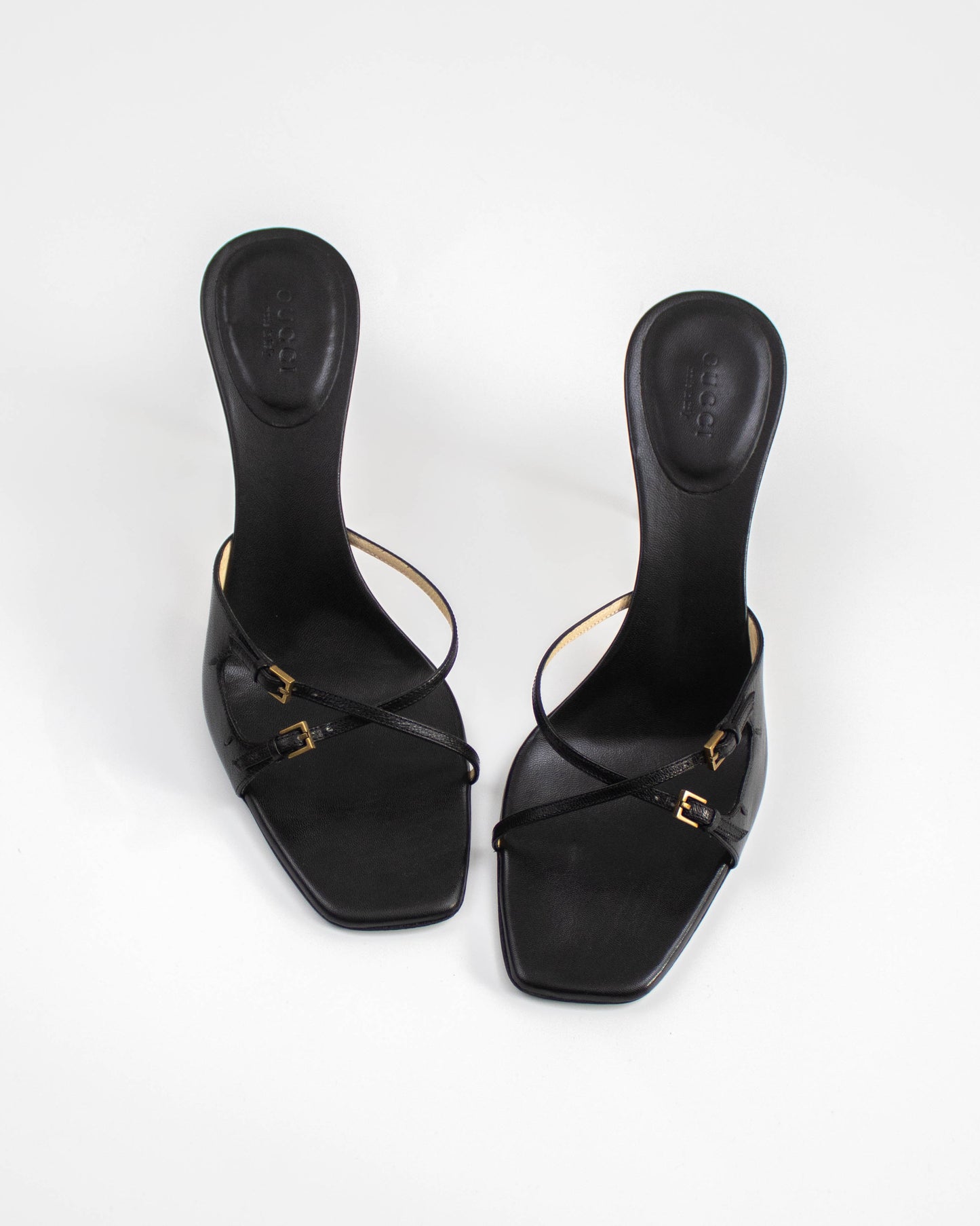 A pair of Vintage Gucci Black Cross Double Strap Heels front view