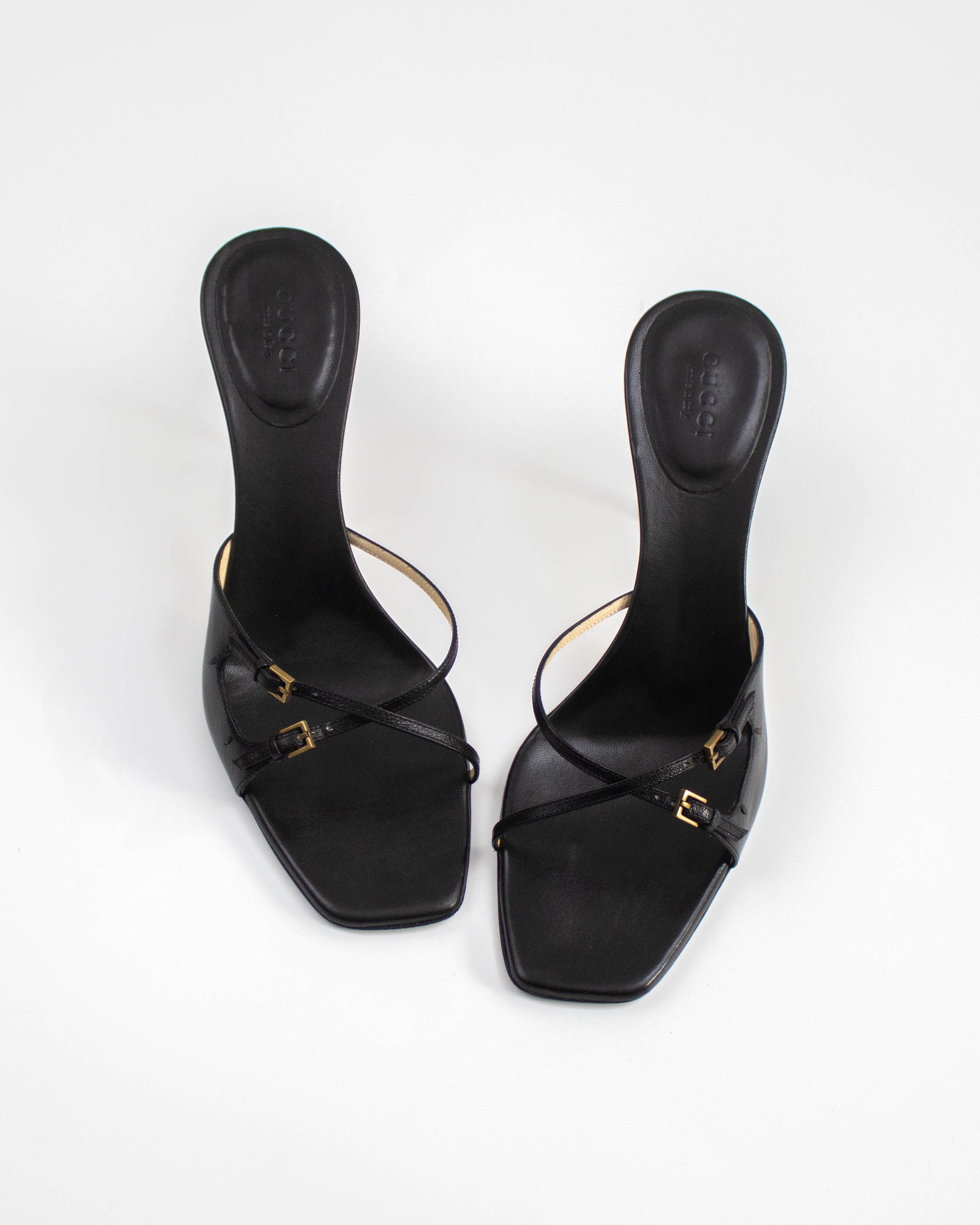 A pair of Vintage Gucci Black Cross Double Strap Heels front view