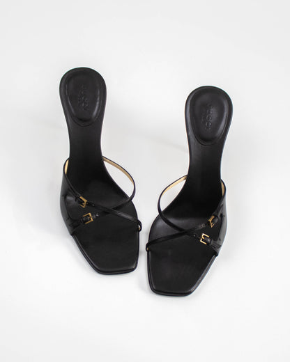 A pair of Vintage Gucci Black Cross Double Strap Heels front view