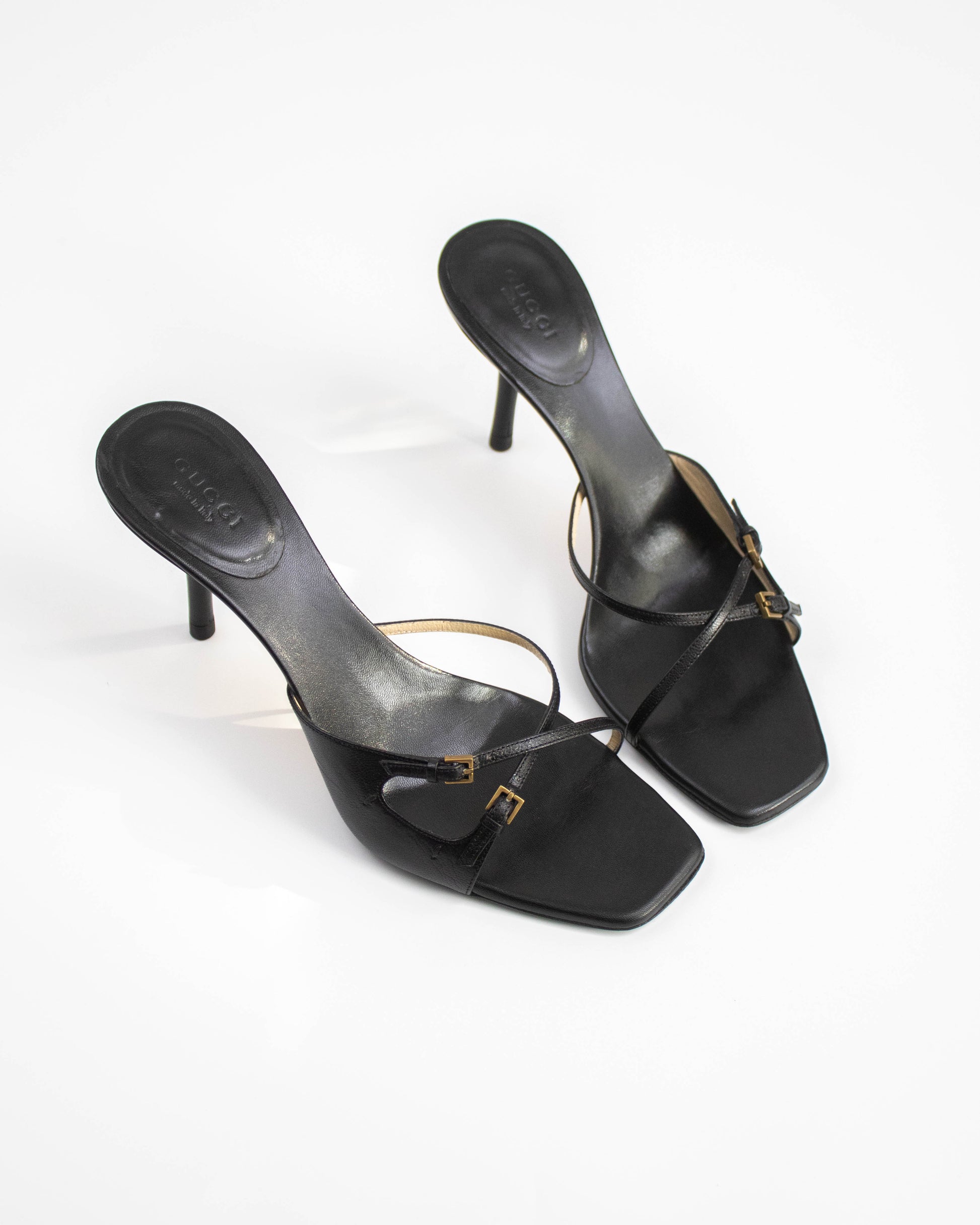 A pair of Vintage Gucci Black Cross Double Strap Heels top view