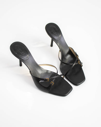 A pair of Vintage Gucci Black Cross Double Strap Heels top view