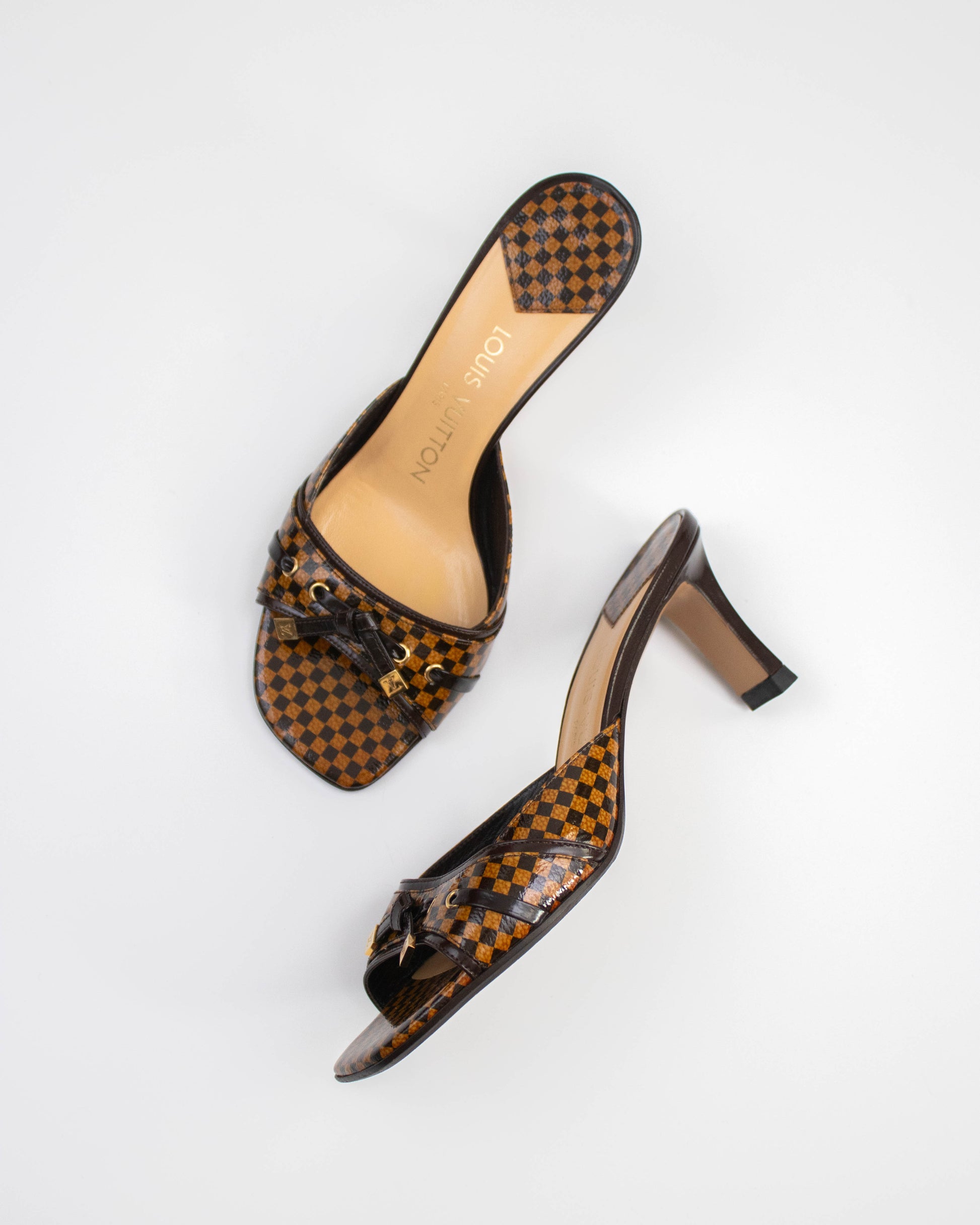 Pair of brown checkered damier Louis Vuitton heels side view 