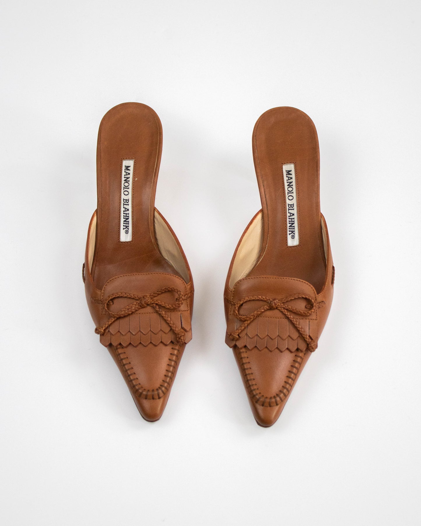Manolo Blahnik fringed mules with bow detail top view