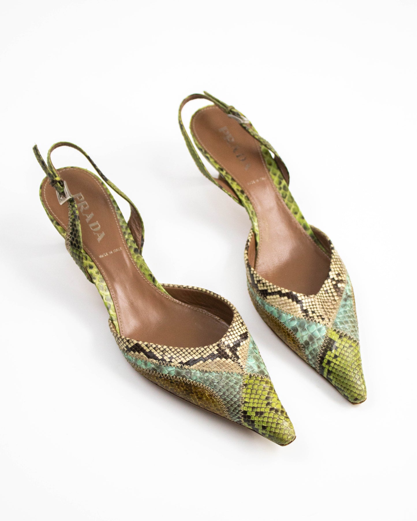 Pair of Prada snake print shoes on a white background front view 