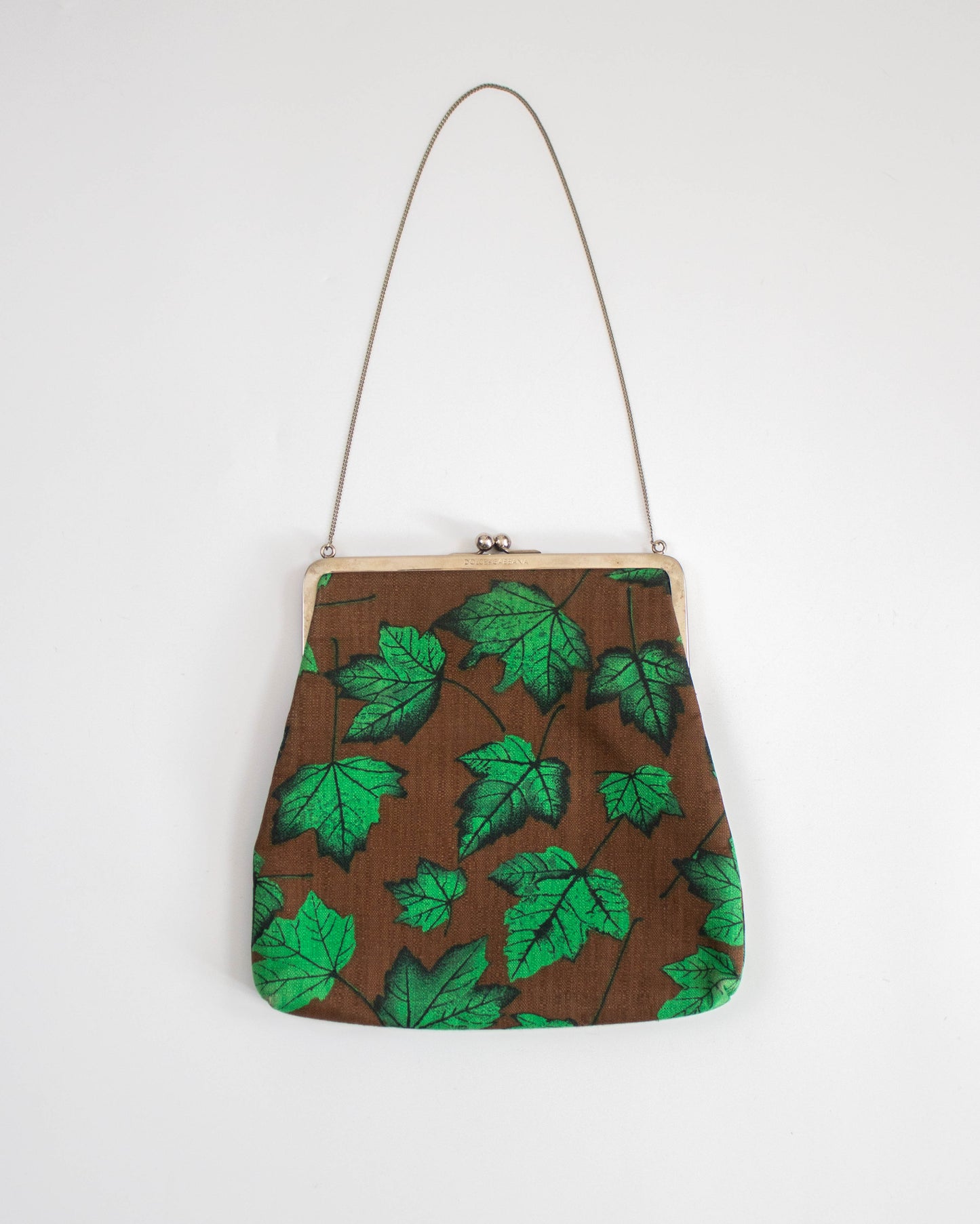 Dolce&Gabbana Handbag with green leaf pattern on a white background