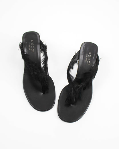 Black Gucci sandals with feather details front view