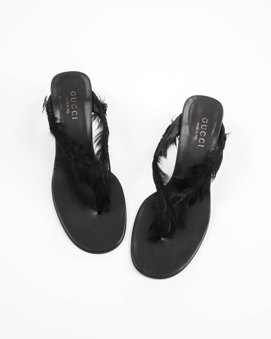 Black Gucci sandals with feather details front view