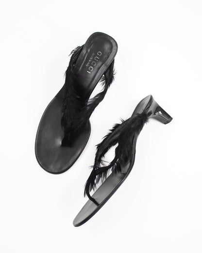 Black Gucci sandals with feather details side view