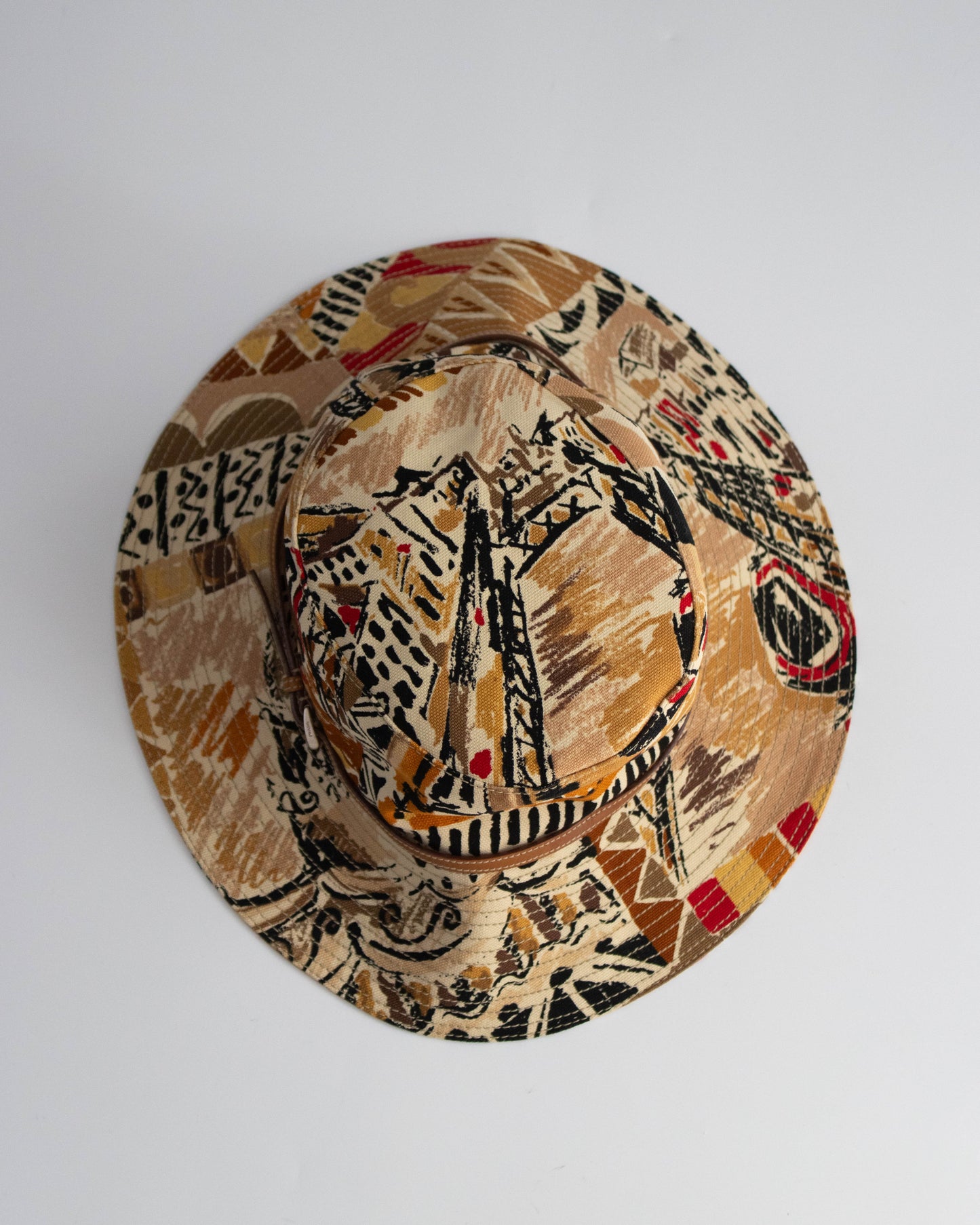 Decorative hat with tribal patterns on a white background