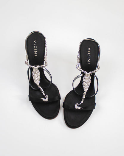 Vicini Giuseppe Zanotti Black sandals with decorative straps and scorpion charms top view